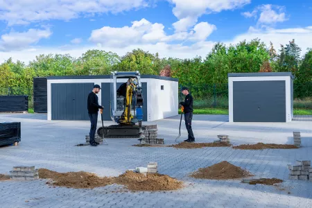 Carport Fundamente erstellen mit einem Minibagger und Erdbohrer