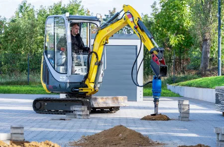 Carport Fundamente erstellen mit einem Minibagger und Erdbohrer