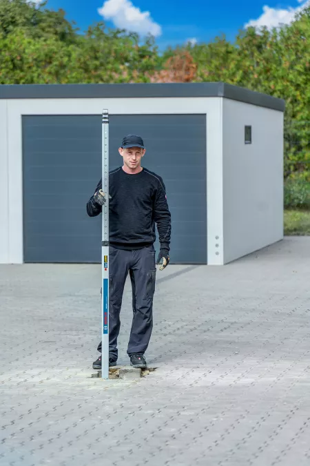 Carport Fundamente erstellen mit einem Minibagger und Erdbohrer